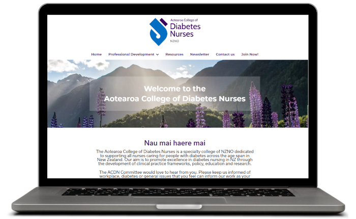 Photo of ACDN website home page on a laptop